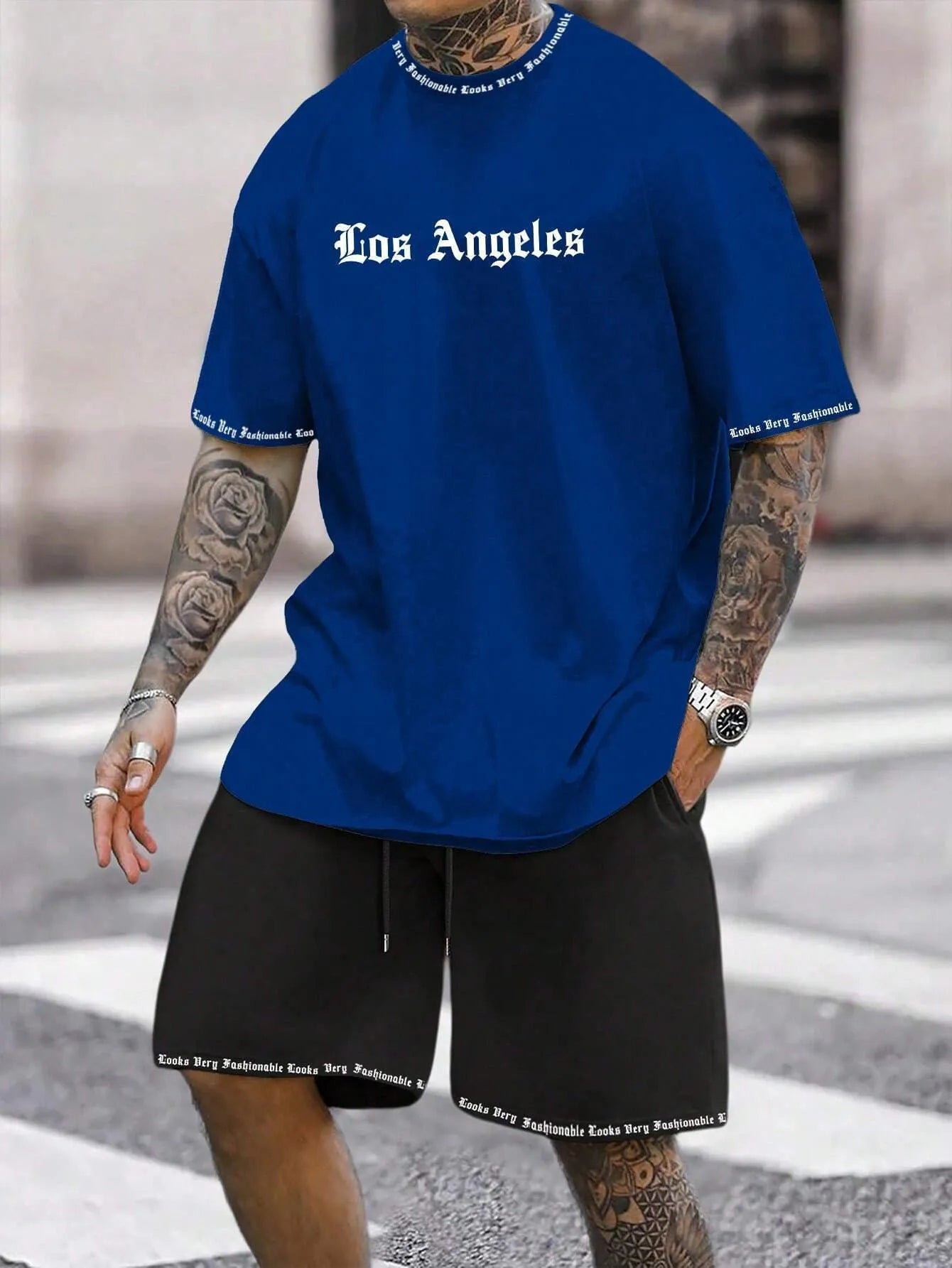 Man wearing a printed short-sleeve sports top and matching shorts in a quick-dry polyester blend.
