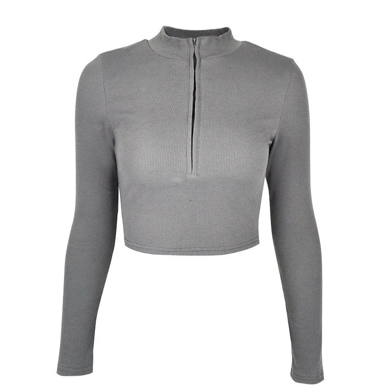 Women's black zip-front crop top with slim fit and long sleeves on hanger