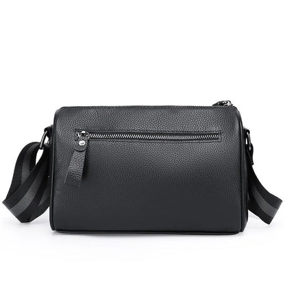 Black genuine leather one-shoulder crossbody bag with large main compartment and polyester lining.