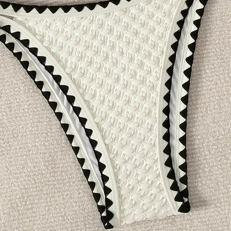 Women's blue or white two-piece bikini swimsuit with briefs style.