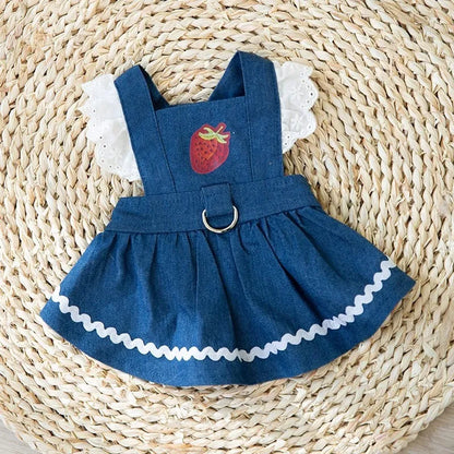 Strawberry print denim-style dog skirt in Bondi Blue colour on a small dog