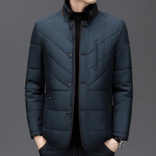 Men's solid colour winter padded coat in dark blue, shown with side seam pockets.