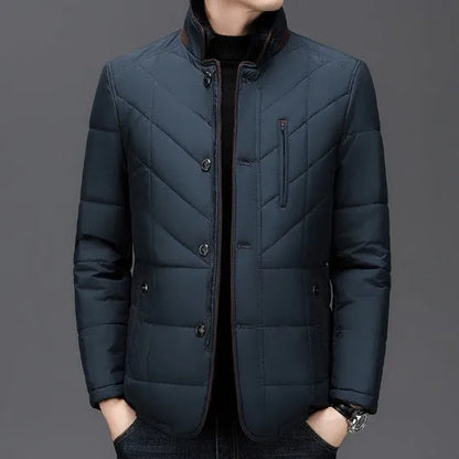 Men's solid colour winter padded coat in dark blue, shown with side seam pockets.