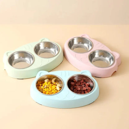 Blue macaron-shaped plastic pet feeder with two food bowls.