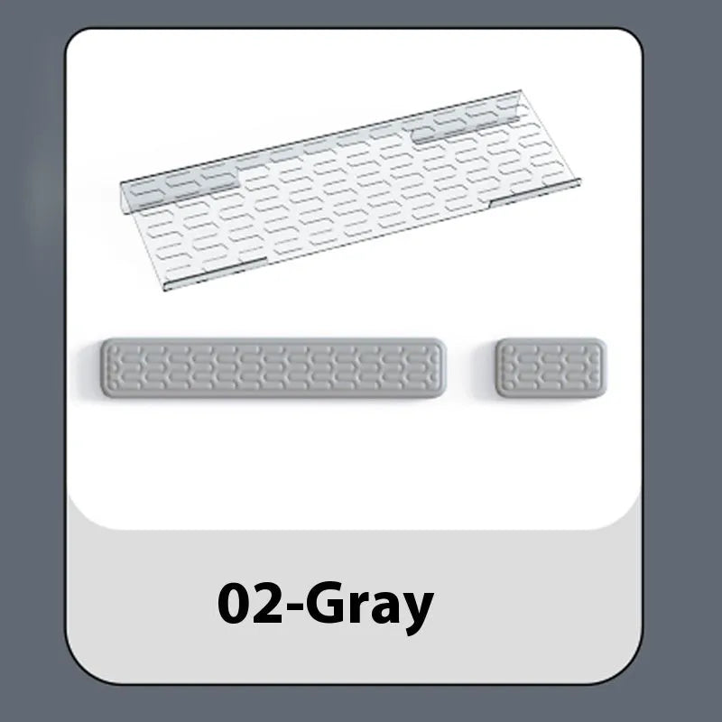 Double-sided black and grey keyboard mouse pad with wrist strap and hand pillow on a desk.