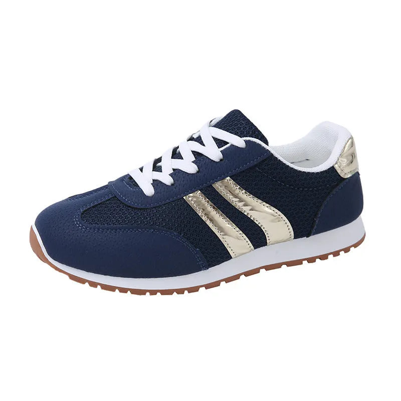 Blue women's casual sports shoes with cross shoulder straps and a round toe, featuring a flat heel and lace-up front.