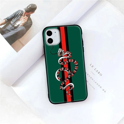 Black frosted silicone iPhone case with cartoon snake design shown on mobile phone