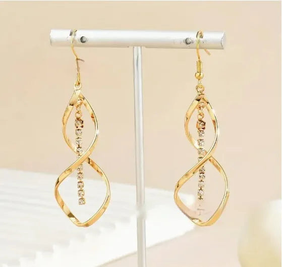 Alloy geometric spiral design gold electroplated drop earrings for women featuring an elliptical shape and refined versatile styling for casual wear or events