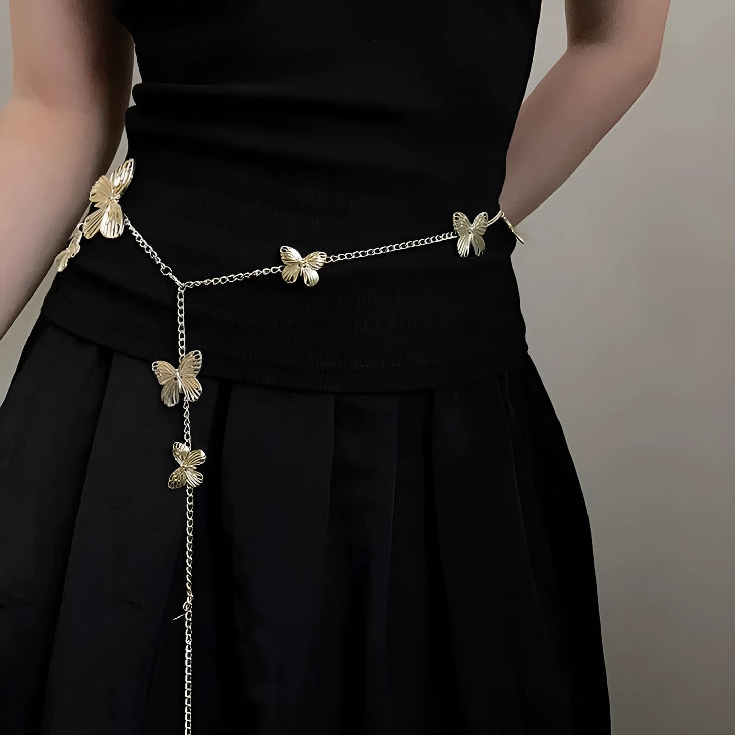 Gold or silver butterfly waist chain belt with alloy construction, measuring 104cm long.