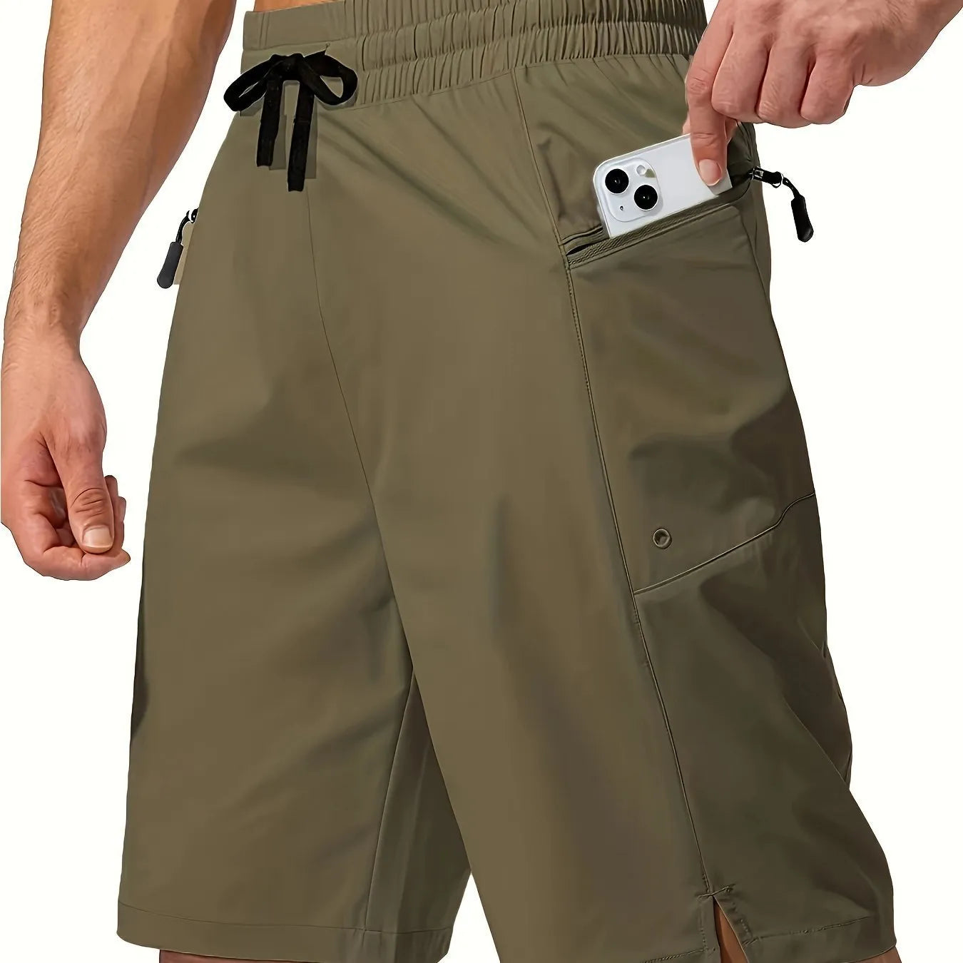 Man wearing solid colour straight-leg beach shorts in quick-dry polyester fabric.