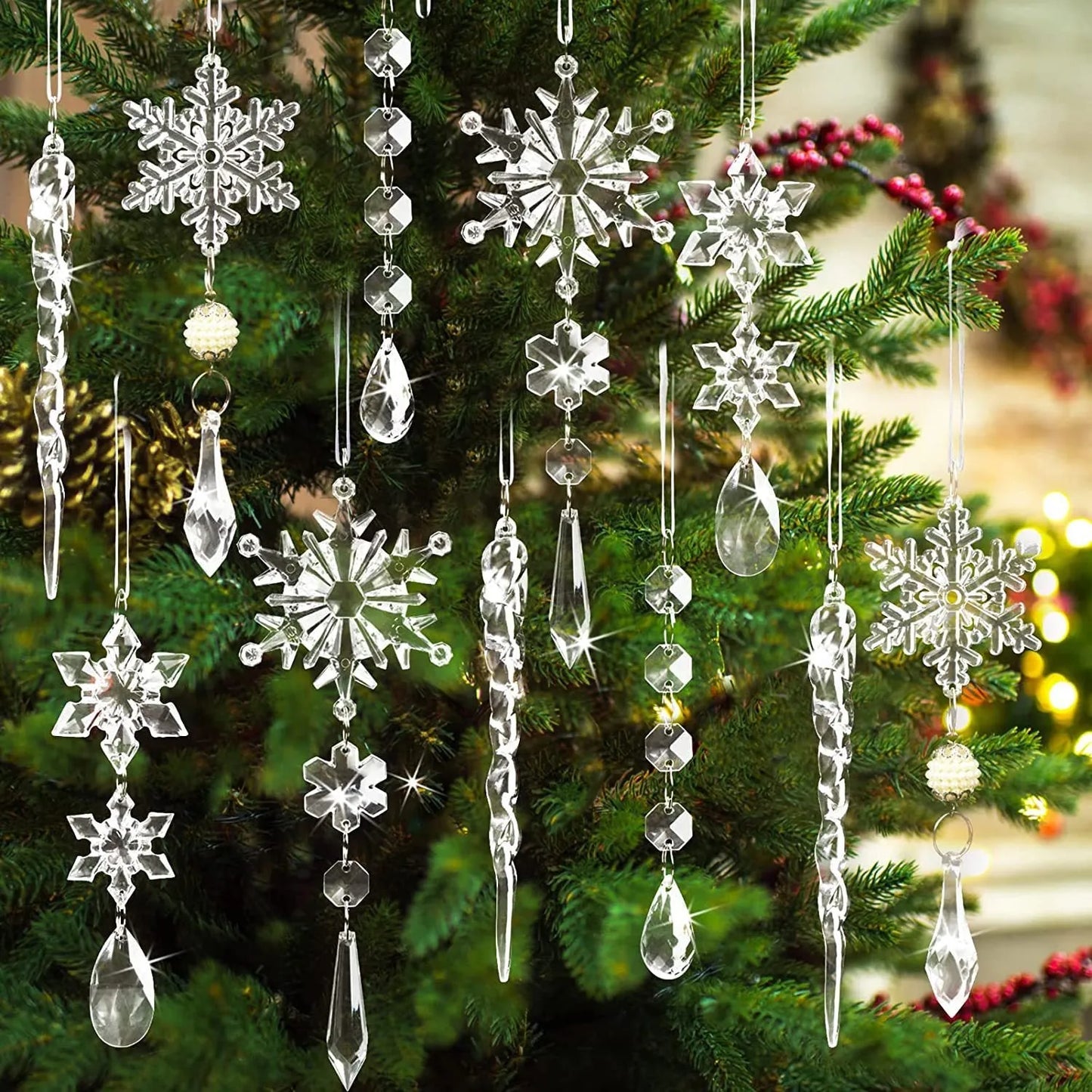 Ten clear acrylic icicle Christmas tree ornaments with hanging holes and white ribbon on pine branches