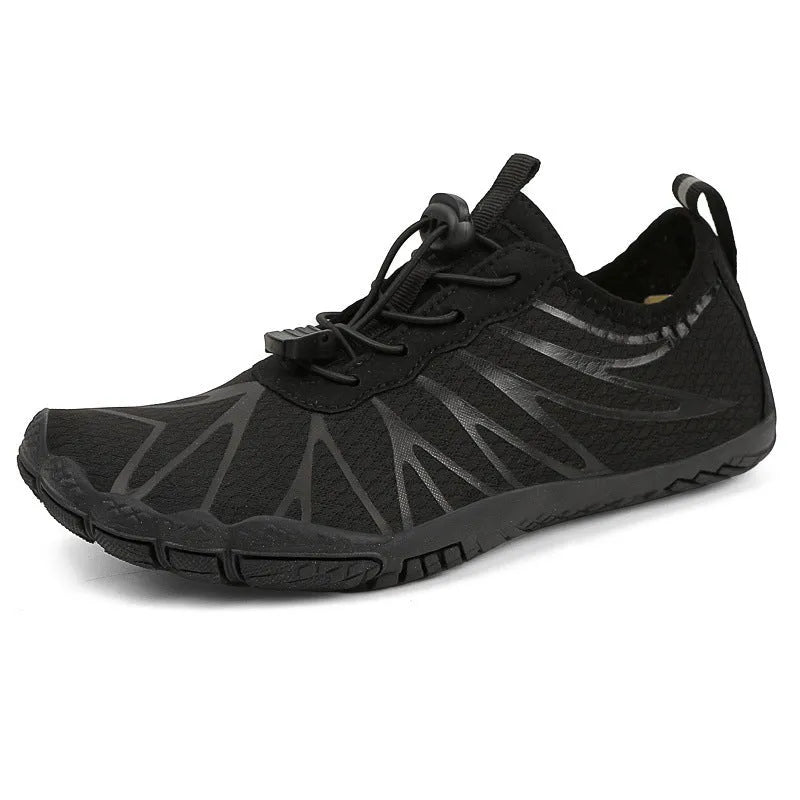 Men's and women's low-top breathable sports running shoes with a natural rubber sole on a hard ground surface.