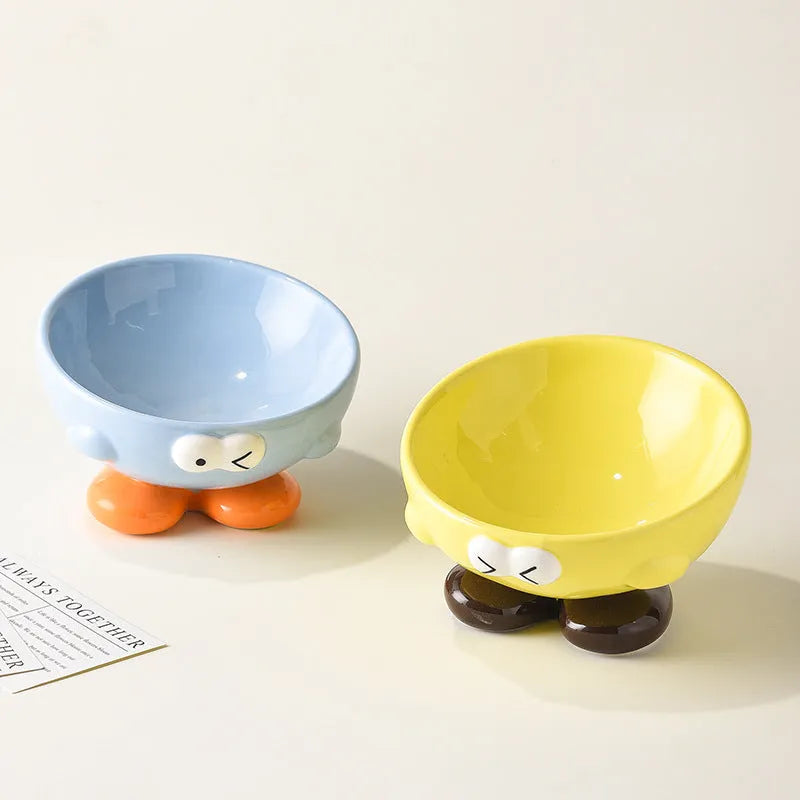 Ceramic slanted pet bowl with decorative expression pattern in blue colour