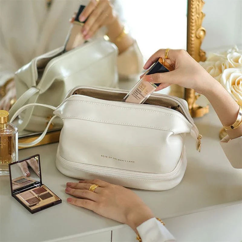 Premium PU leather cosmetic bag with large capacity, versatile storage, and water-resistant design for modern women on the go