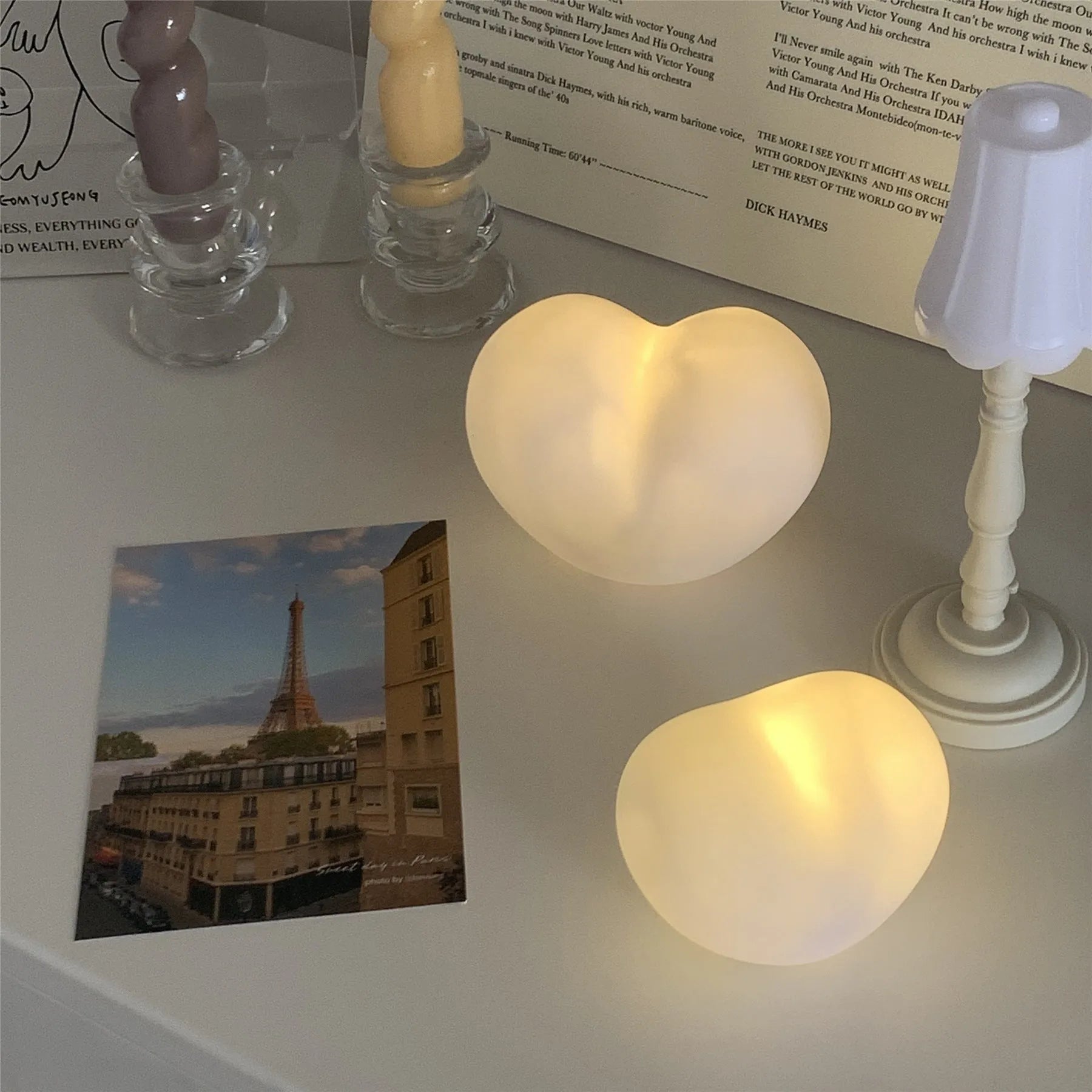 White and pink vinyl atmosphere lamps in trumpet and tuba shapes showing 8cm and 11cm size options
