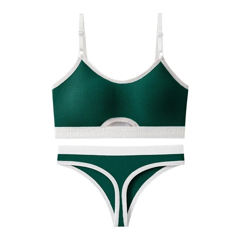 White underwired sports bra set with contrast dark grey back detailing and matching briefs on a mannequin.