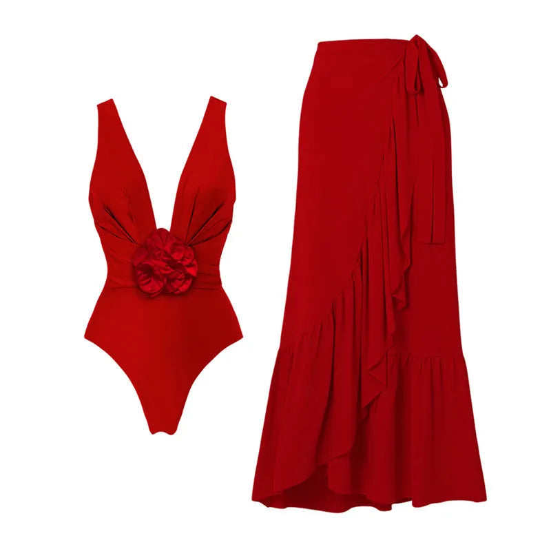 Red women's V-neck halter swimsuit with open back and a matching detachable long skirt laid flat.