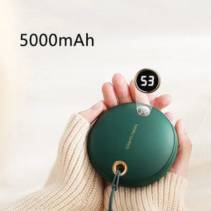 Green portable power bank with digital display showing battery percentage, sized next to a mobile phone for scale