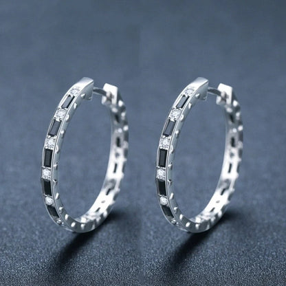 Elegant black zircon earrings featuring a geometric design, crafted from premium copper for a lustrous finish