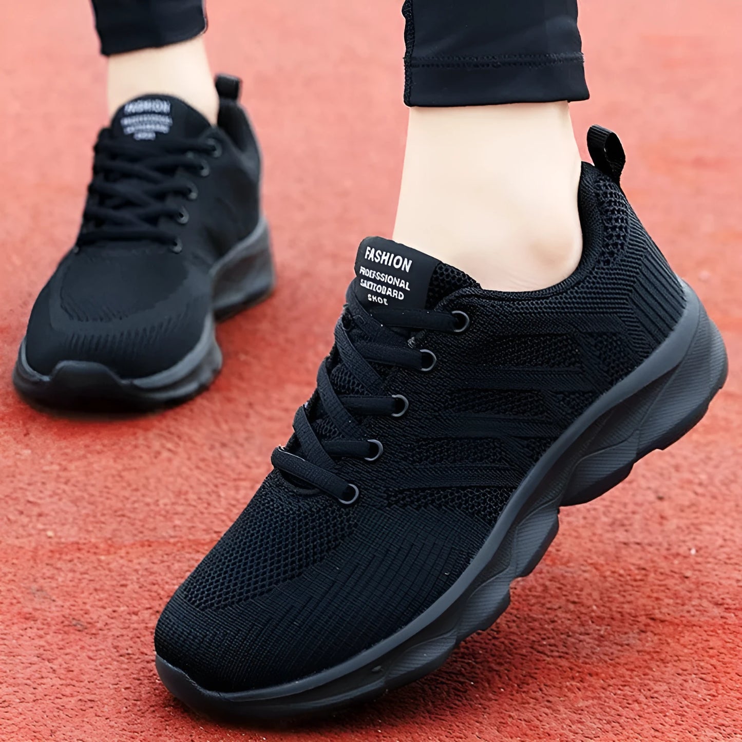 Women's white mesh leisure shoes with lace-up front and low heel on a neutral background.