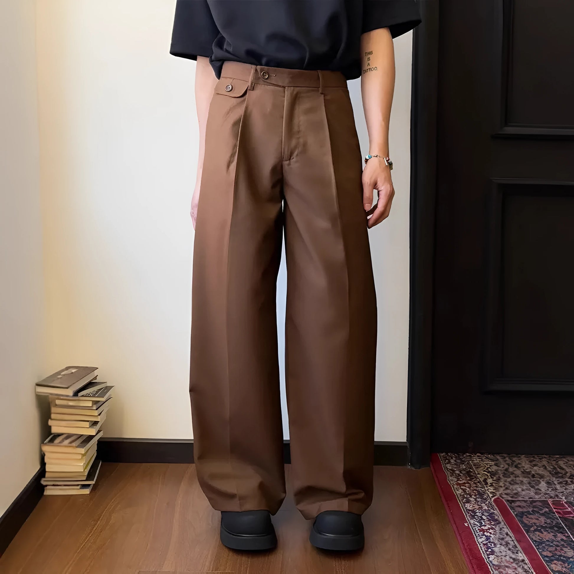 Man wearing straight-leg wide-leg casual trousers in brown, showcasing the relaxed drape and fit.