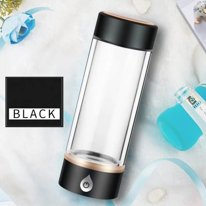 Portable hydrogen water ionizer bottle with high borosilicate glass cup in silver finish.