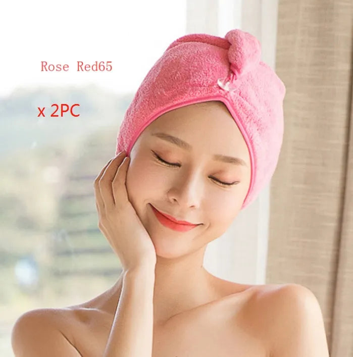 A woman wearing a sky blue microfiber hair dryer cap, with wet hair tucked inside, showing the towel's wrap-around design.
