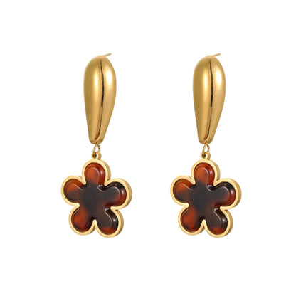 Women's tortoiseshell resin style earrings with 18K gold electroplated finish on stainless steel, heart and floral designs