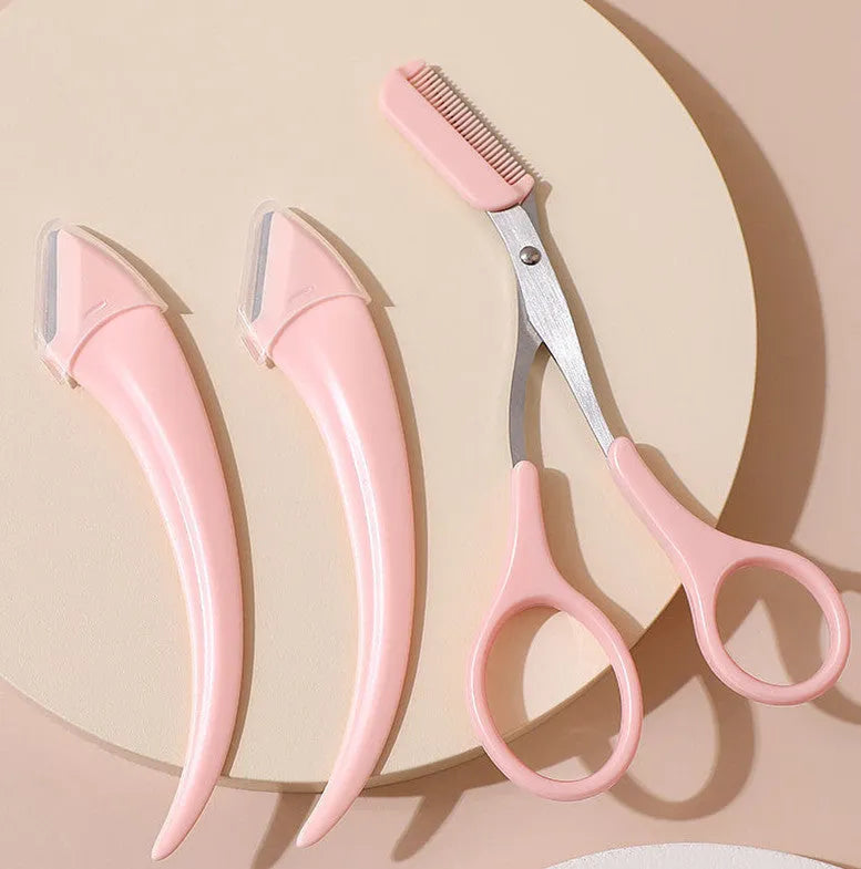 A curved moon-shaped eyebrow trimming knife and a cutting comb on a white background.