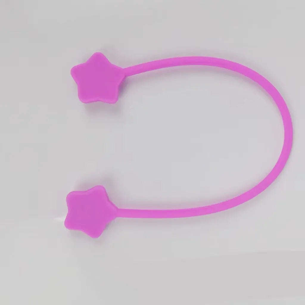 Silicone magnet wire winder for cable organisation in assorted colours on a white background.