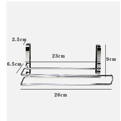 Silver stainless steel paper towel rack hanging on a cabinet door