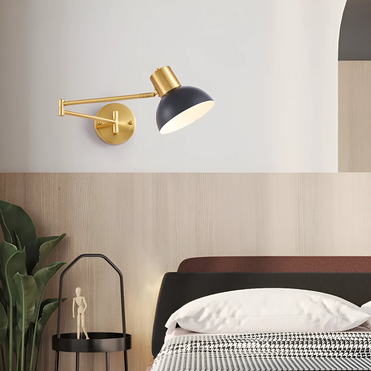 Modern minimalist double-section metal rocker arm wall lamp extending from a wall, showing its adjustable joints.