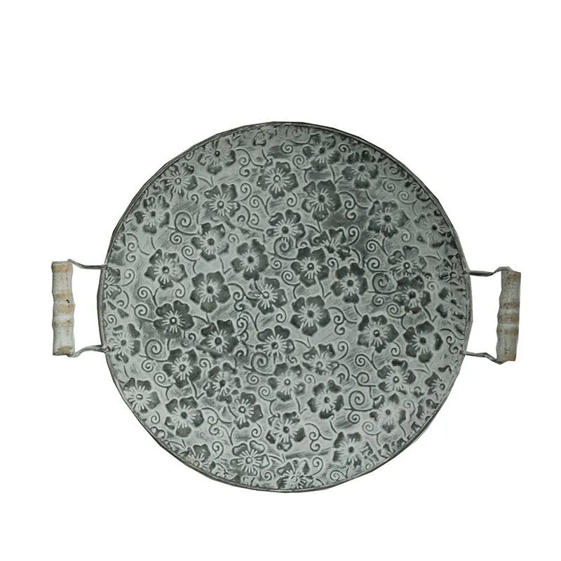 Round wrought iron storage tray in two sizes for organising jewellery or household items.