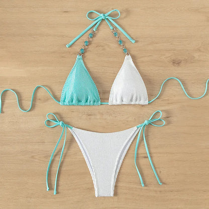 Women's colour matching swimsuit with lace-up detail and pearl chain decoration