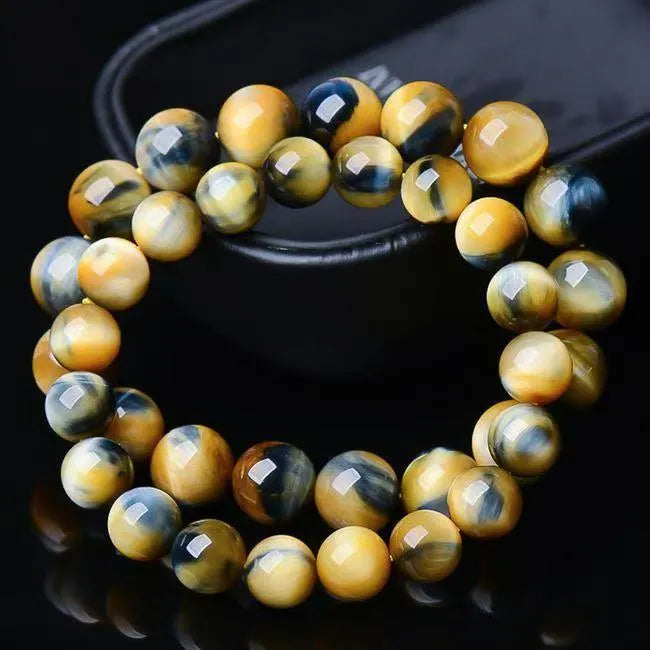 Fantasy tiger eye agate unisex bracelet with round beads in geometric single-circle design.