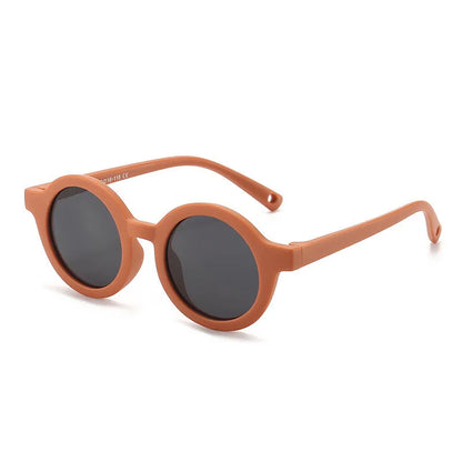 Children's round-frame polarised sunglasses with soft TPEE frame for ages 0-3, shown in assorted colours.