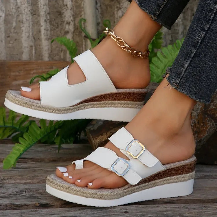 Women's wedge sandals with peep toe and woven design, featuring a wedge heel and finger-fit construction in patent leather with cloth lining, available in white colour with rubber sole across sizes 36-43 for casual wear and fashion styling.