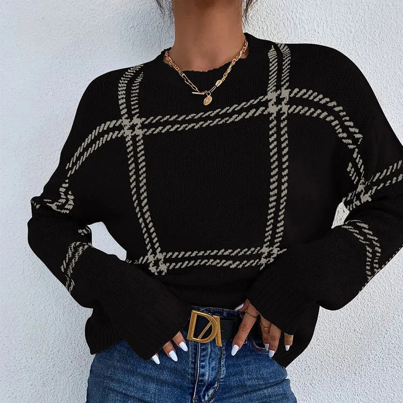 Women's loose-fitting plaid crew neck sweater with apricot, black, beige, red, and green colour-block stripes.