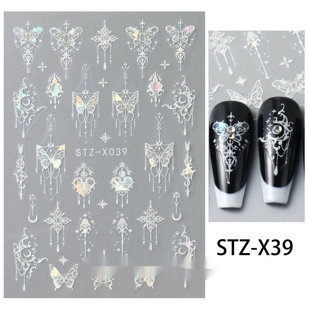 Assortment of black and silver nail sticker designs including cartoon and French tip patterns on a plastic sheet.