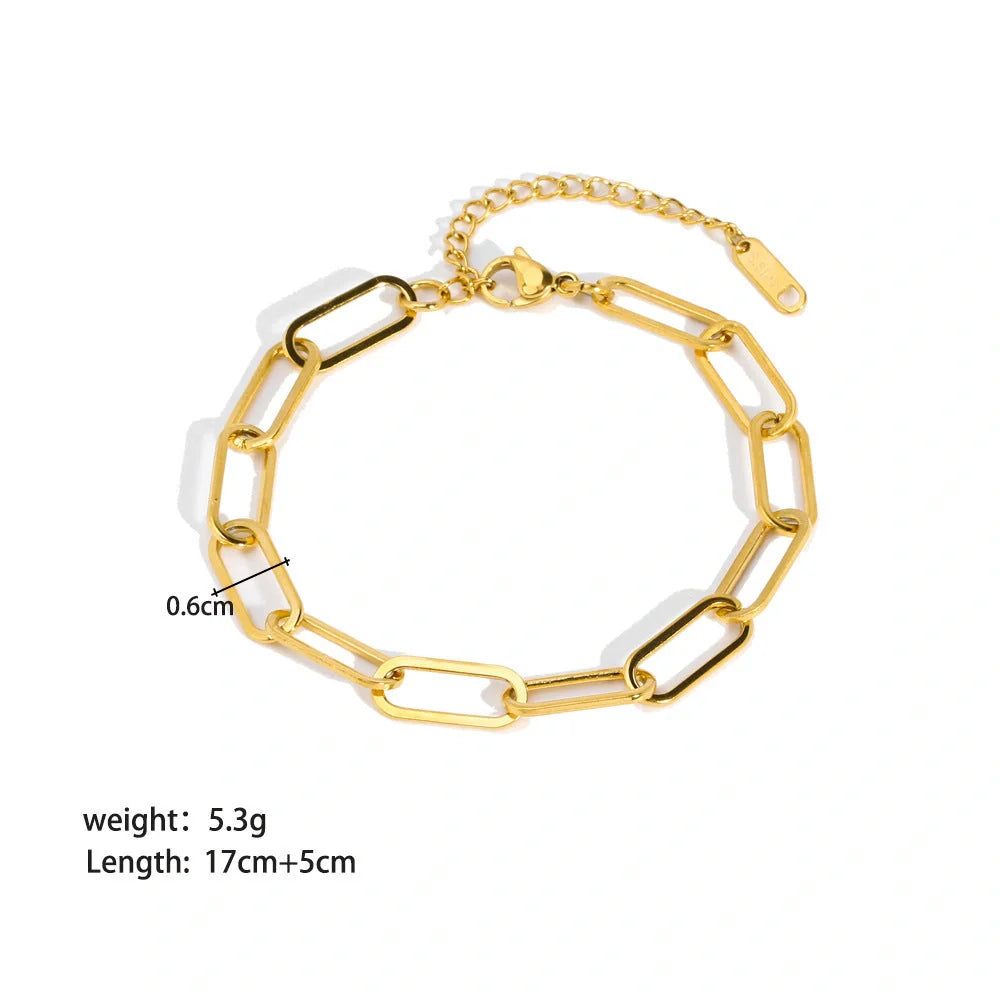 Elegant stainless steel bracelet with a sleek geometric design, gold-plated finish, and unisex style suitable for any occasion.