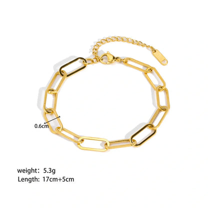 Elegant stainless steel bracelet with a sleek geometric design, gold-plated finish, and unisex style suitable for any occasion.