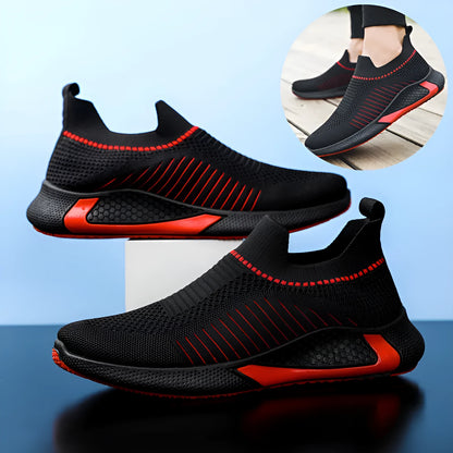 Men's black and white striped slip-on sneakers with lace-up front and mesh upper.