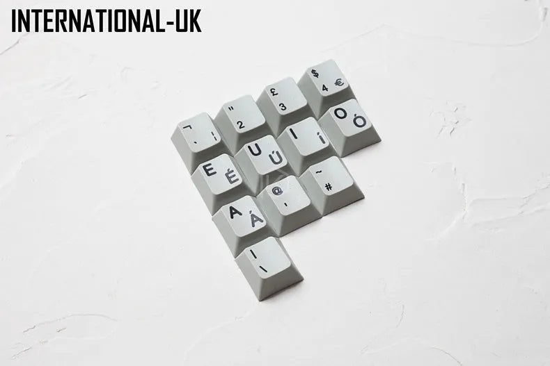 Wired keyboard with international symbol keycaps for ten European language layouts showing USB and PS/2 connections