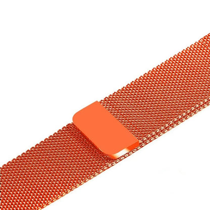 Stainless steel Apple Watch strap in silver on a wrist, showing the metal links and secure clasp.