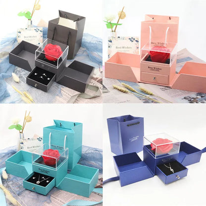 Cardboard jewellery gift box with inner packaging compartments, shown in pink colour.