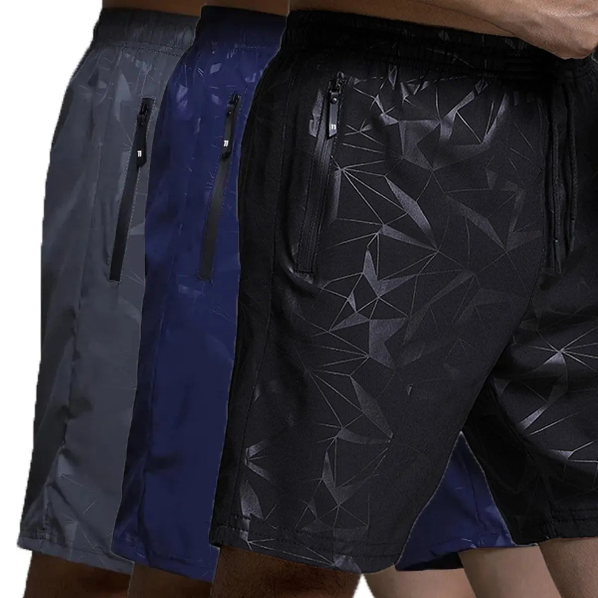 Man wearing loose-fit grey printed sports shorts with elastic waistband, showcasing the above-knee length.