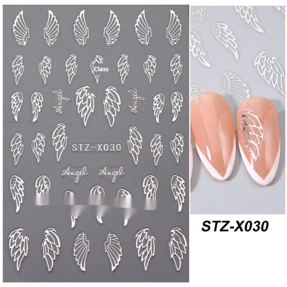 Assortment of black and silver nail sticker designs including cartoon and French tip patterns on a plastic sheet.