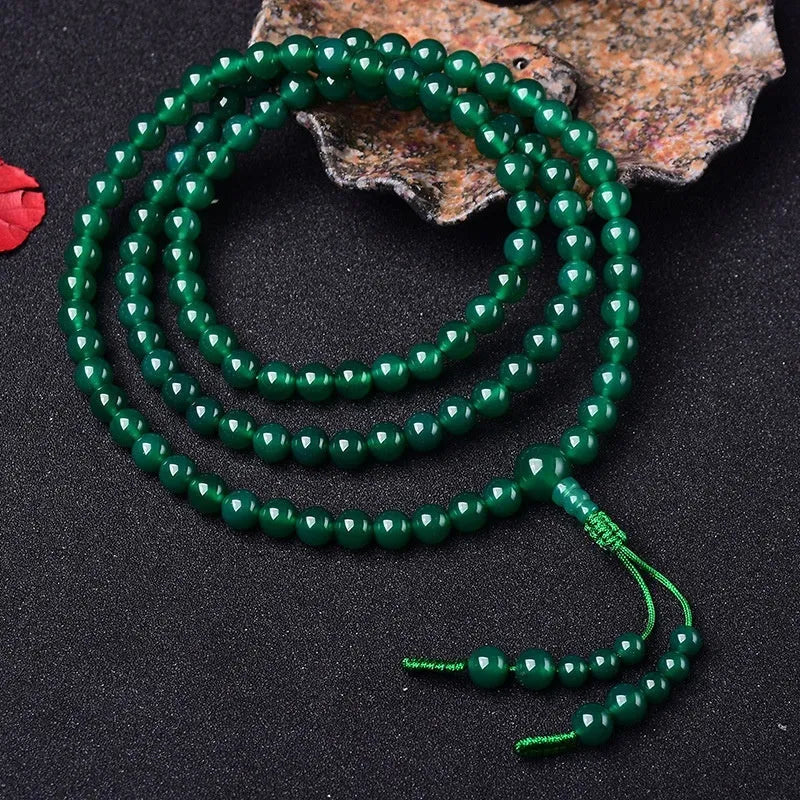 Green agate multi-circle bracelet with 108 beads and a pendant, showing Buddha beads or Thangka style options.