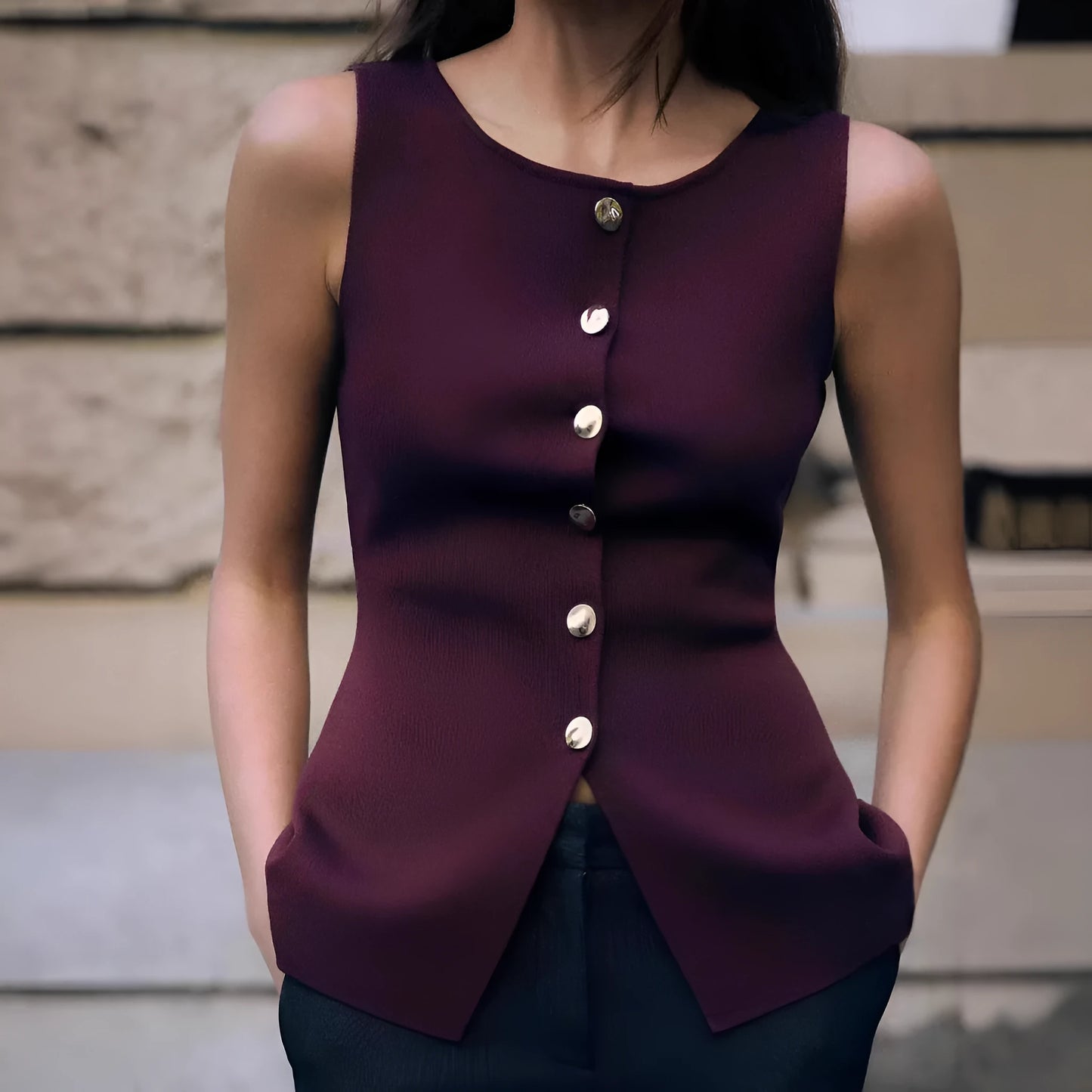 Women's dark red slim fit sleeveless sweater vest with gold buttons on a hanger.
