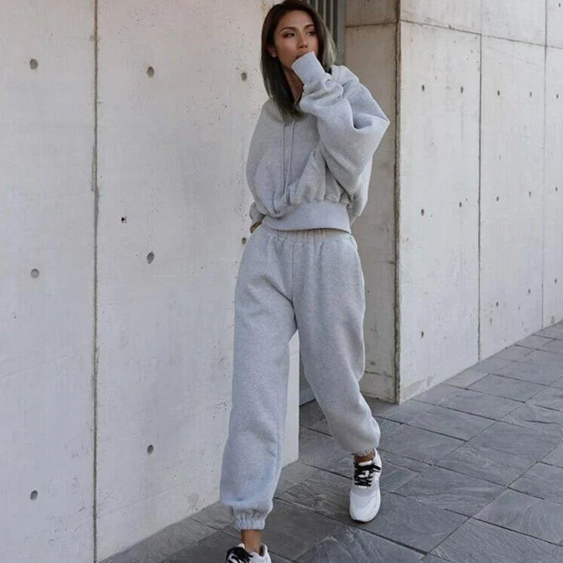 Women's polyester hoodie jacket and sports pants set in various colors for casual and athletic wear